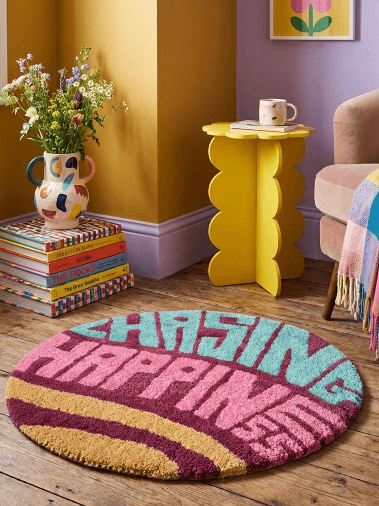 Image may contain Home Decor Rug and Cup